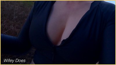 wifey public cleavage flashing in a tight shirt with perfect braless tits.